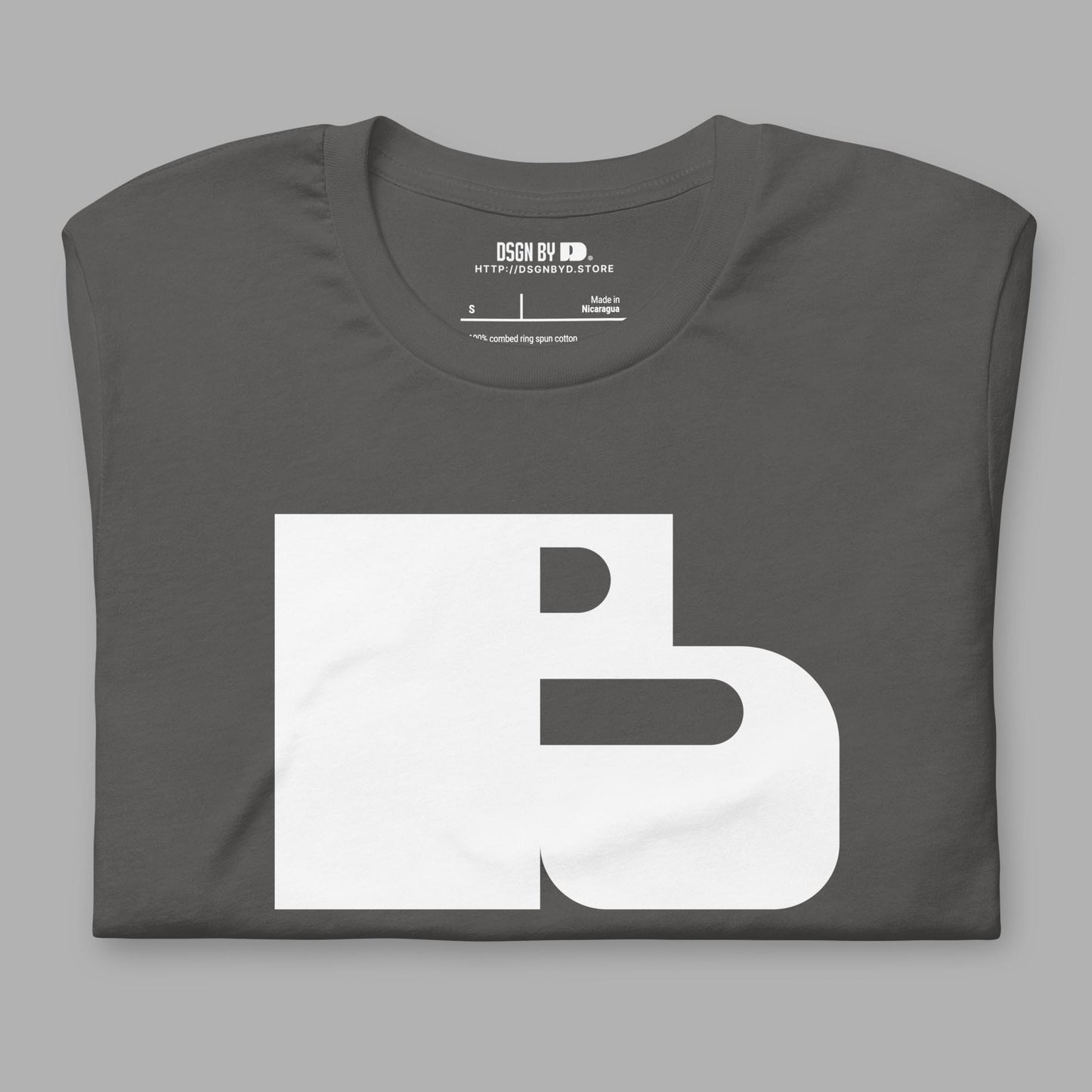 A folded grey cotton unisex graphic tee with letter B.