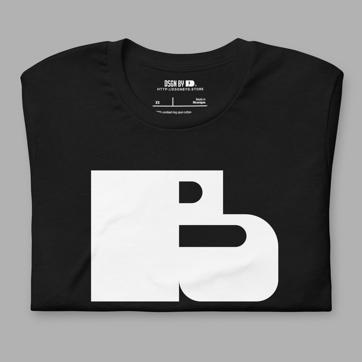 A folded black cotton unisex graphic tee with letter B.