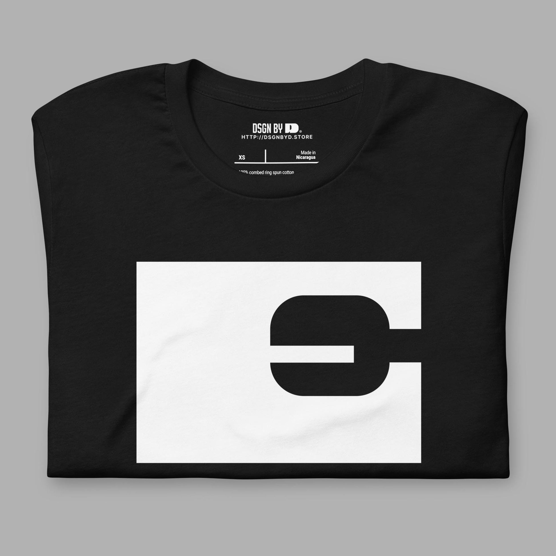 A folded black cotton unisex graphic tee with letter E.