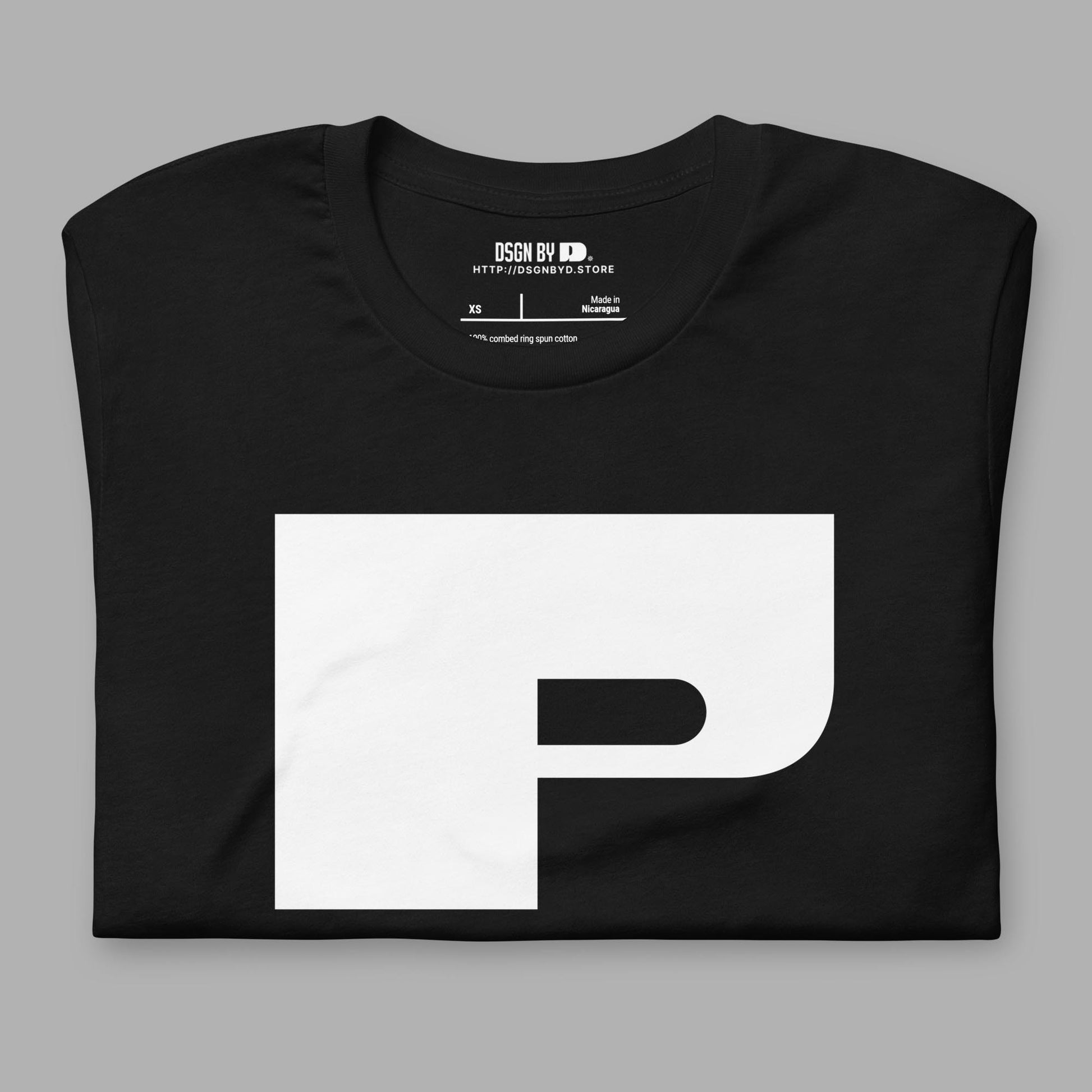 A folded black cotton unisex graphic tee with letter P.