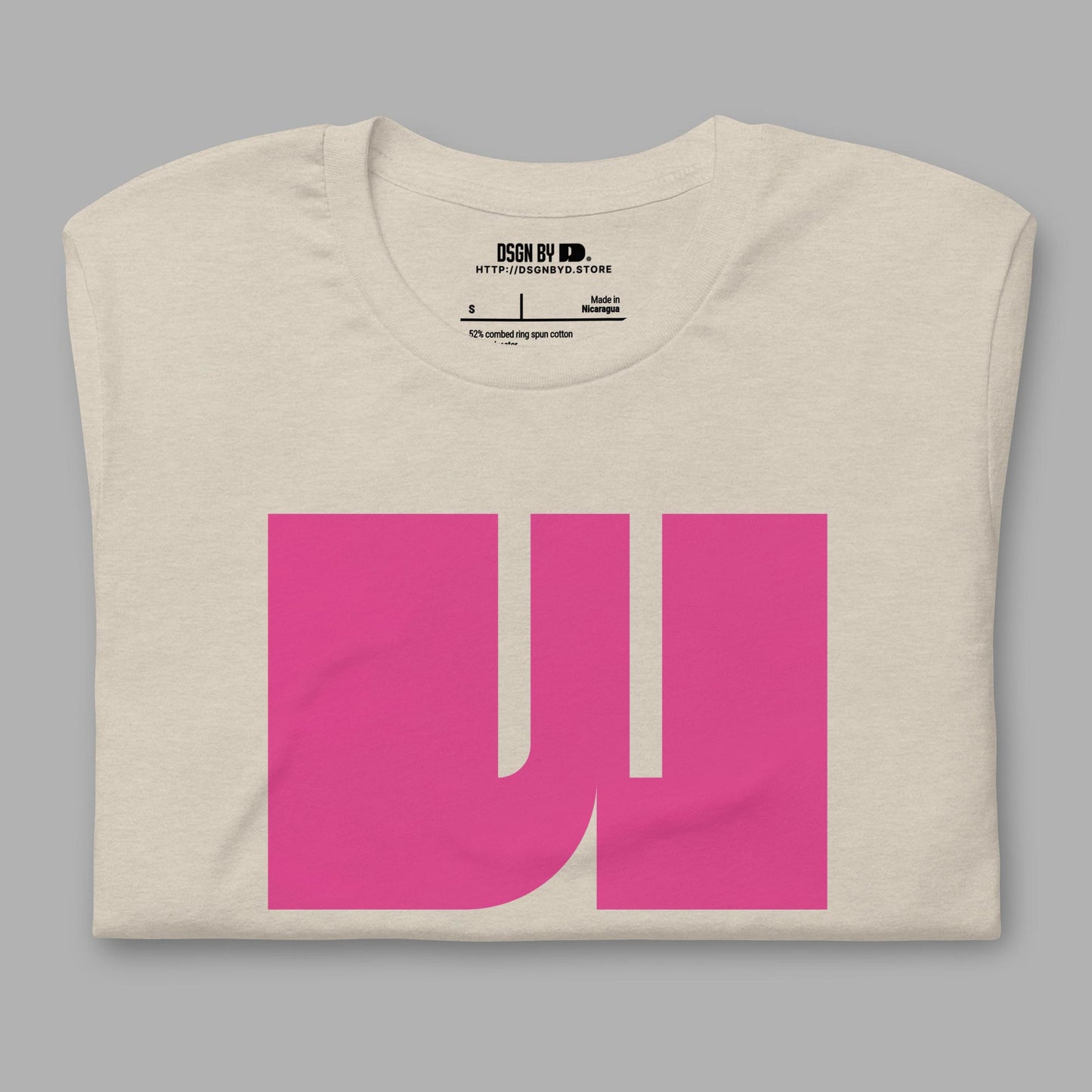 A folded beige cotton unisex graphic tee with letter W.