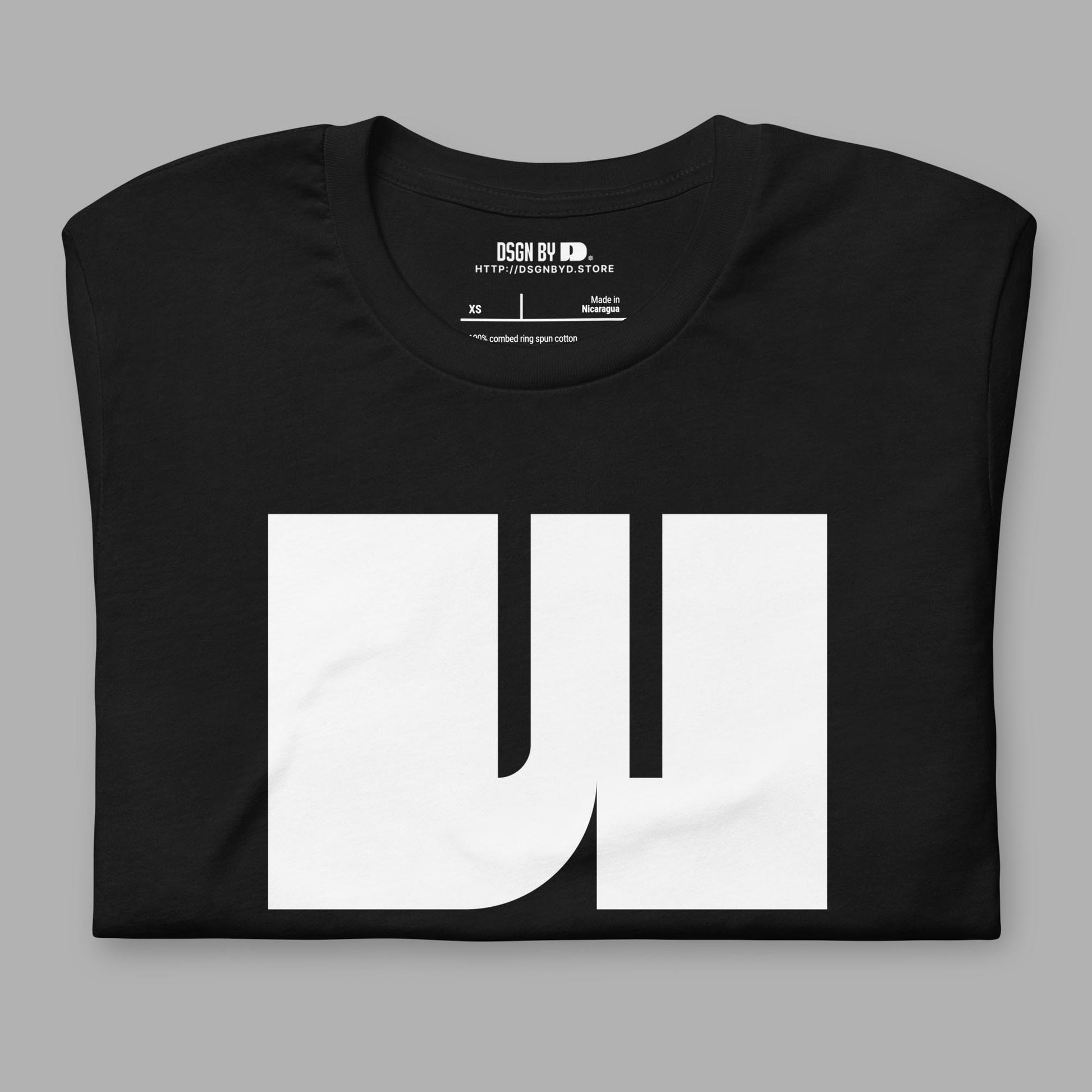 A folded balck cotton unisex graphic tee with letter W.