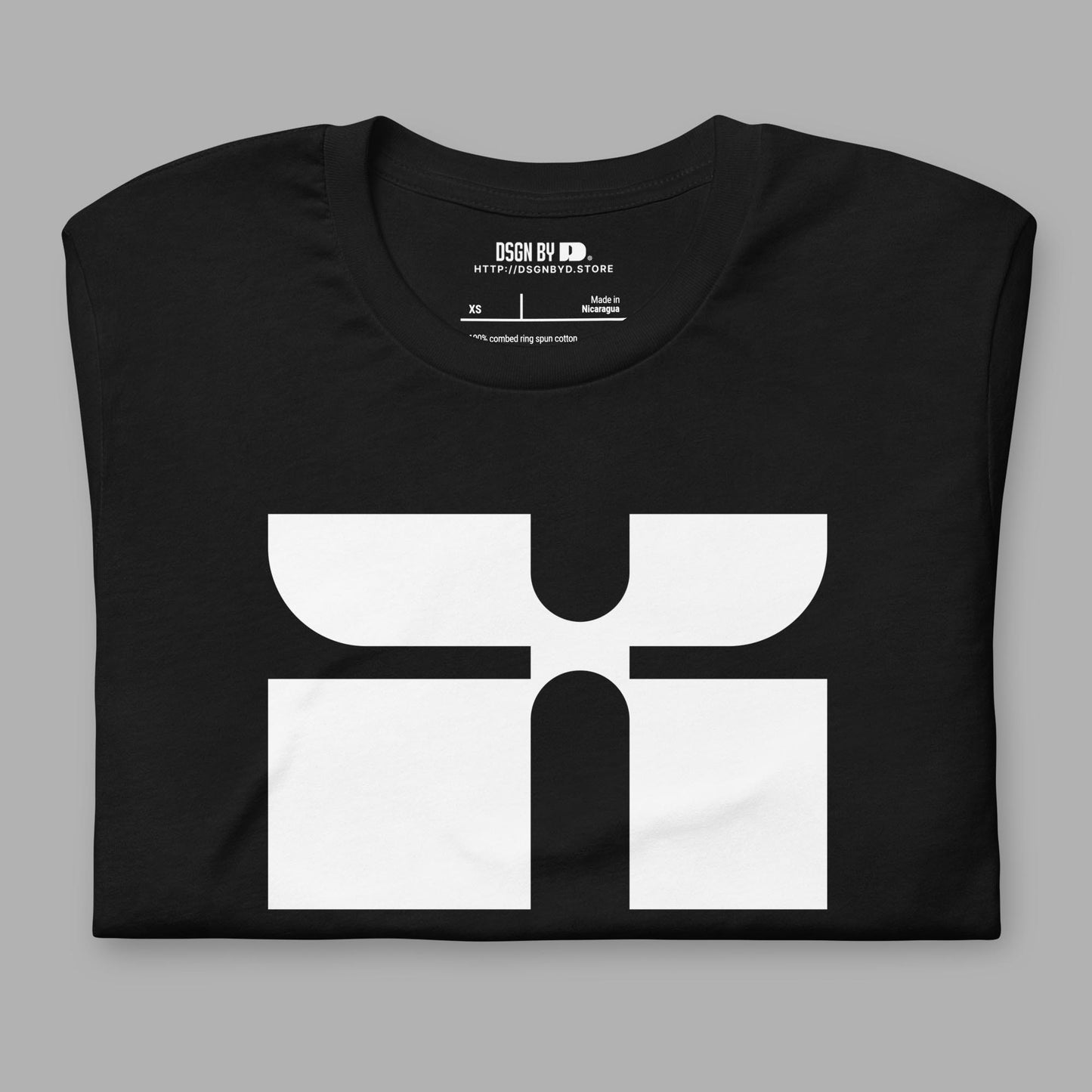 A folded black cotton unisex graphic tee with letter X.