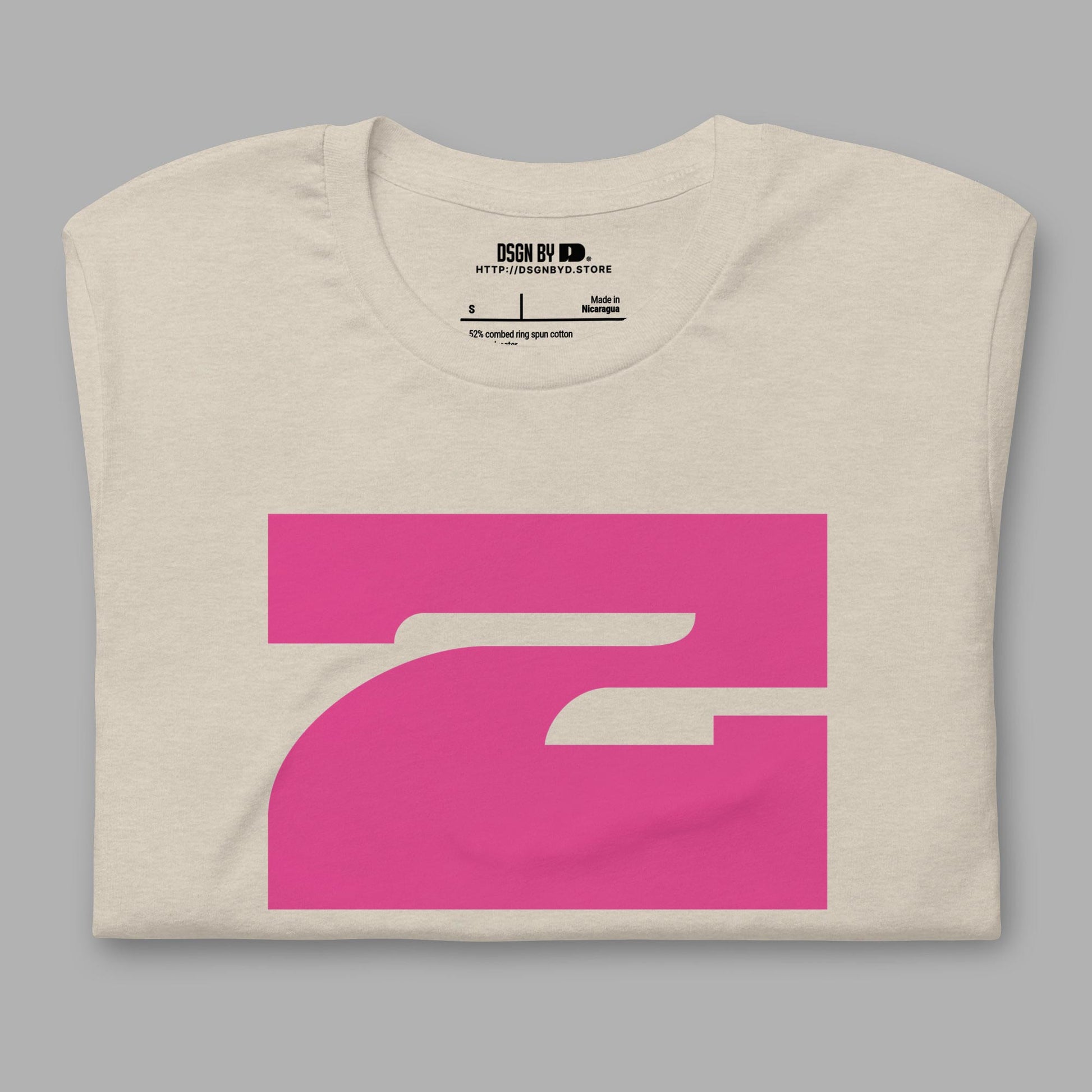 A folded beige cotton unisex graphic tee with letter Z.