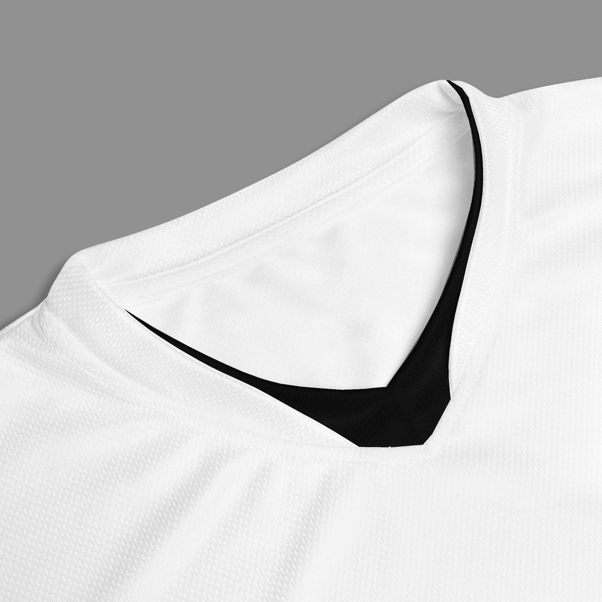 Detail of a white sports jersey with "Design is thinking made tangible" printed on the jersey. 